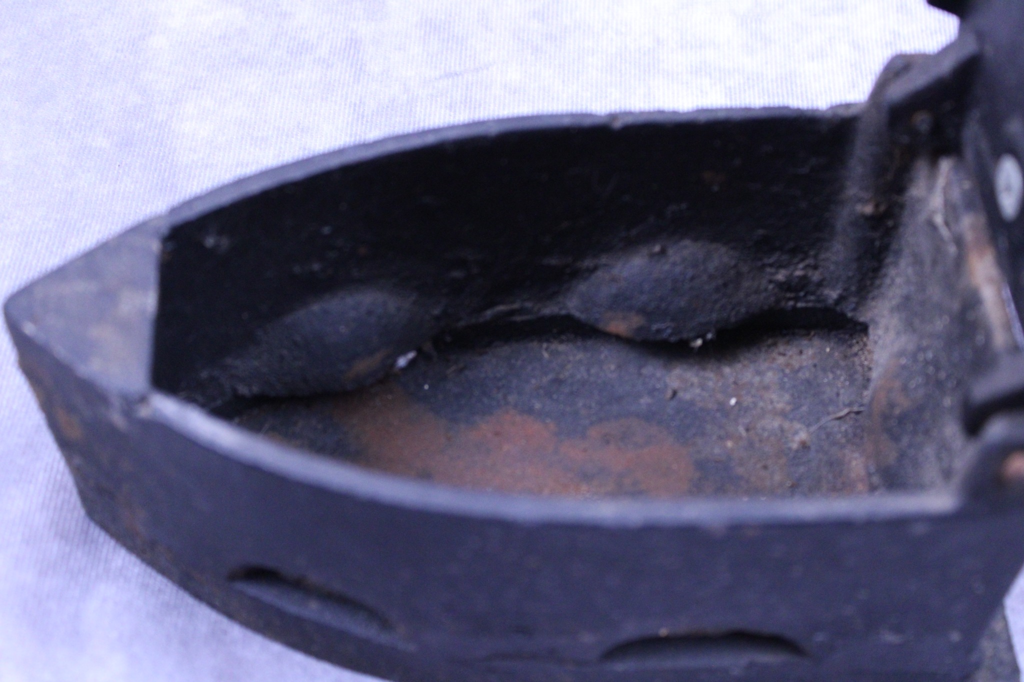 Interior charcoal chamber of the vintage cast iron box iron