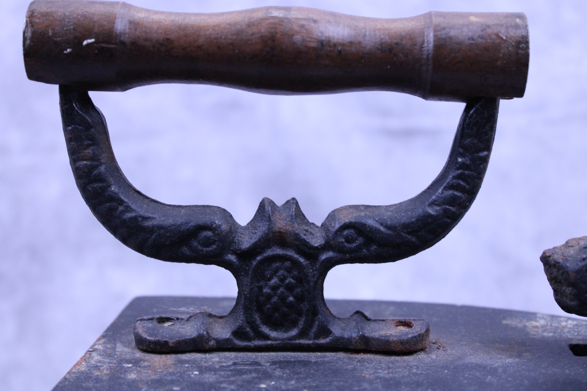Turned hardwood handle and cast iron handle support